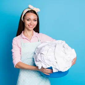 Woman Holding Tub Of Laundry 600X600